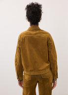 Back view of brass Olivia jacket showing seamless shoulder design by French Dressing Jeans (FDJ)