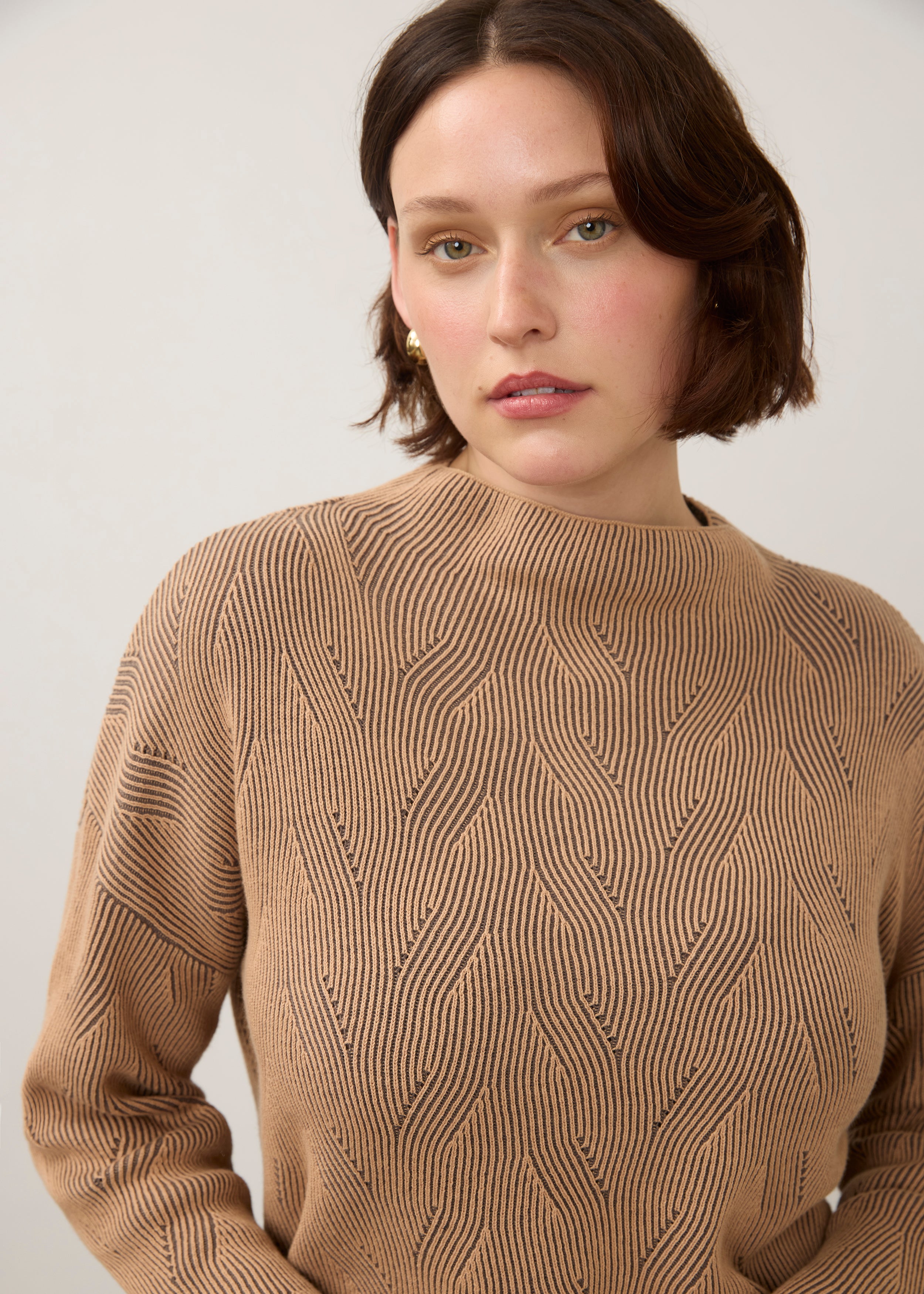 Close-up of tan textured top with high collar detail by French Dressing Jeans (FDJ)