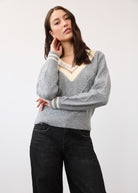 Close-up of Sparkle V-neck sweater in gray showing cable knit and ribbed cuffs by French Dressing Jeans (FDJ)