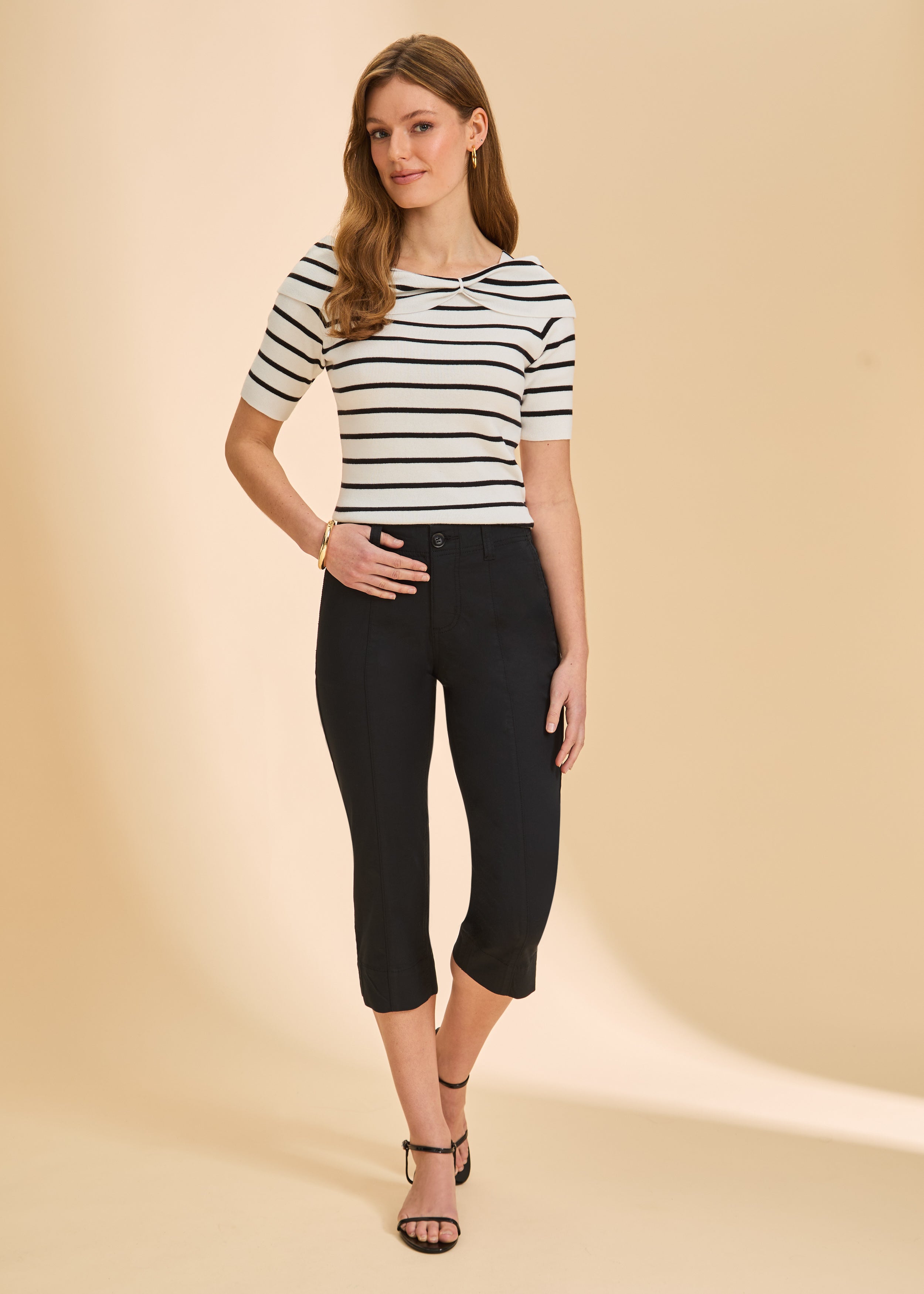 Front view of black crop pants with high-rise fit and slim silhouette by French Dressing Jeans (FDJ)