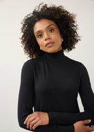 Close-up of black turtleneck top focusing on neckline and soft stretch fabric by French Dressing Jeans (FDJ)