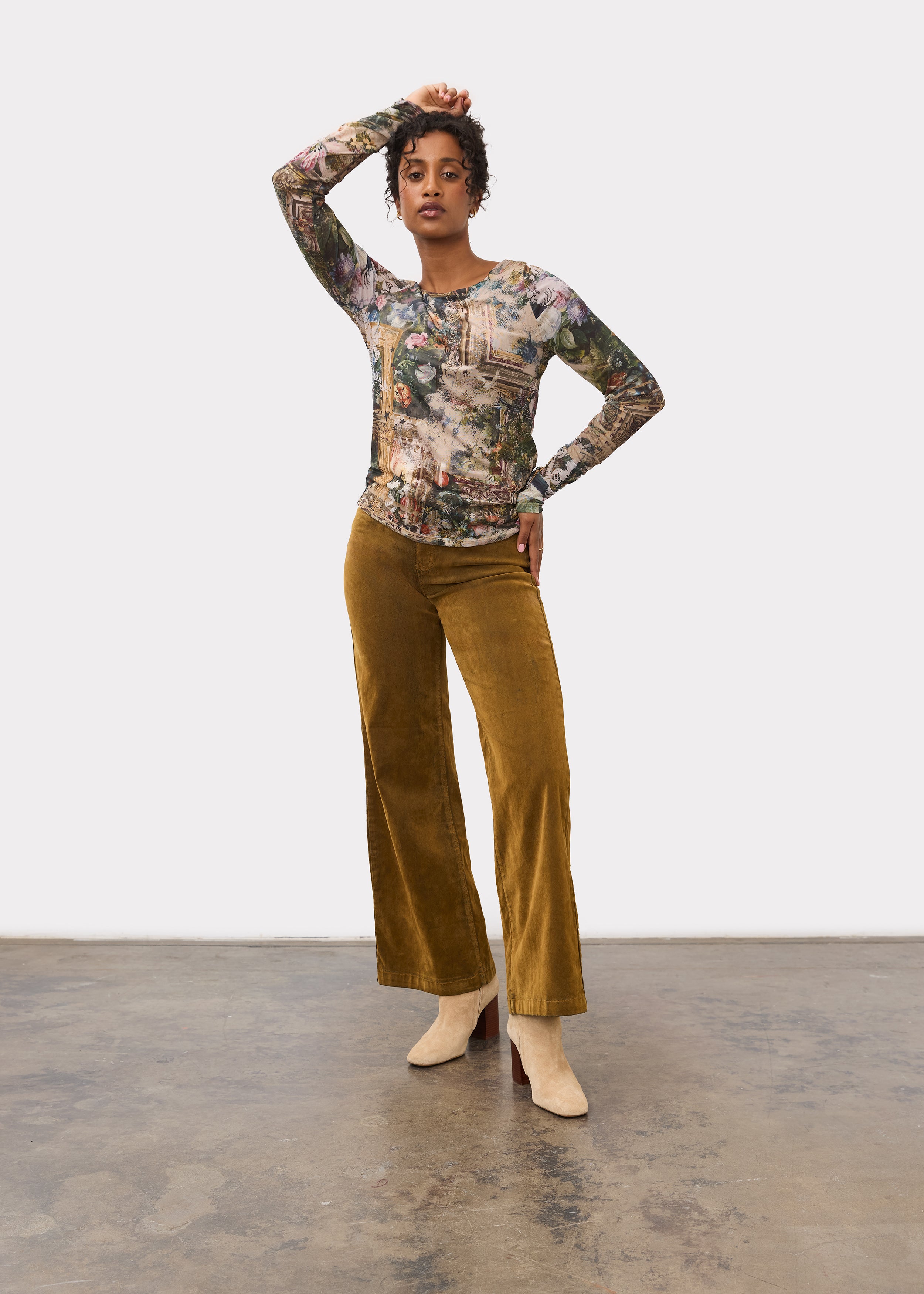 Full view of floral print top paired with mustard wide-leg pants and beige boots by French Dressing Jeans (FDJ)