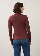 Back view of burgundy turtleneck top showcasing simple elegance and seamless design by French Dressing Jeans (FDJ)