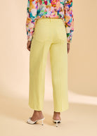 Yellow wide-leg pants back view showing patch pockets by French Dressing Jeans (FDJ)