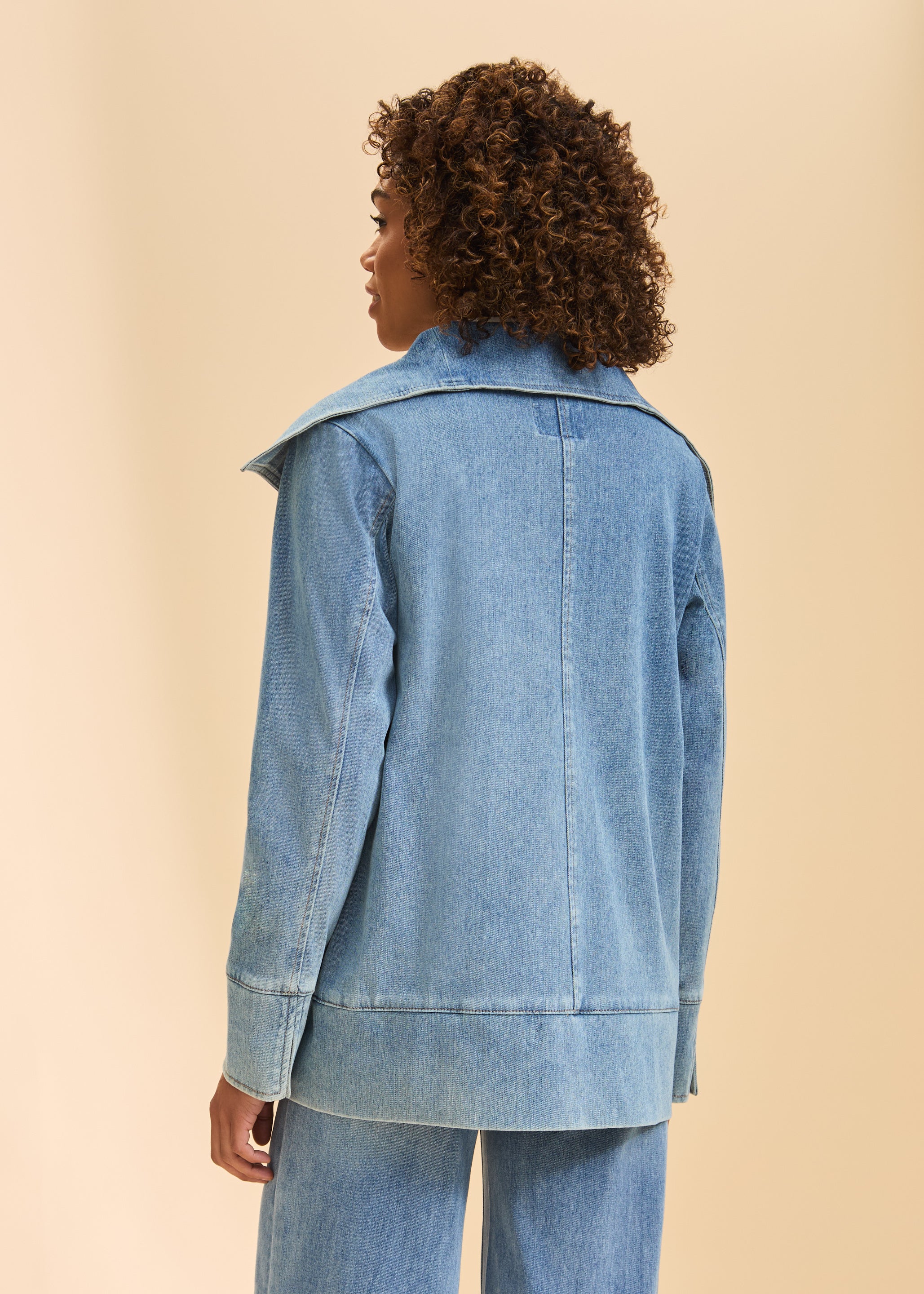 Back view of light blue denim jacket highlighting seam detail and wide collar by French Dressing Jeans (FDJ)