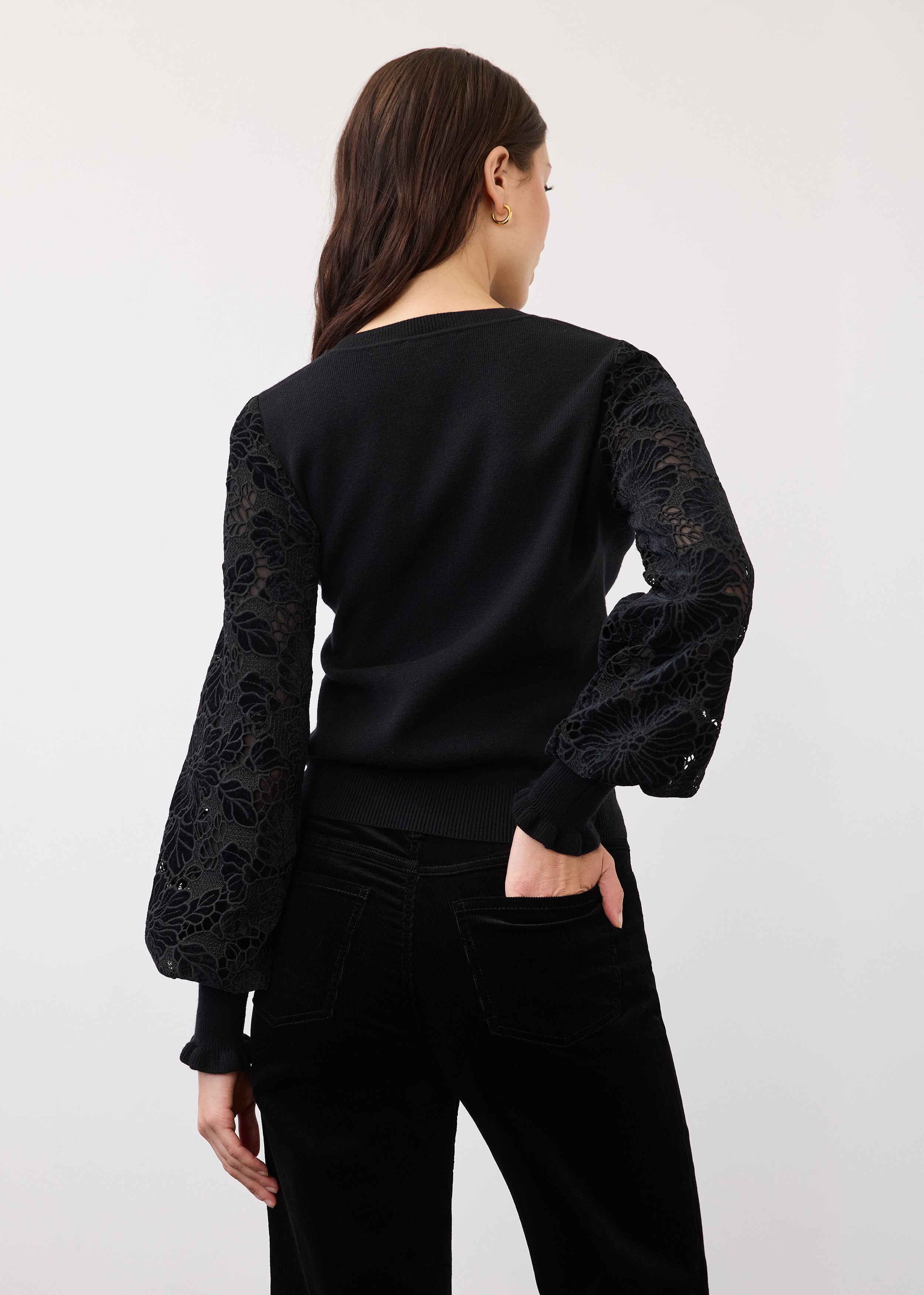 Back view of black sweater with velvet detailing on sleeves by French Dressing Jeans (FDJ)