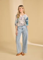 Full view of pastel top paired with light jeans for relaxed style by French Dressing Jeans (FDJ)