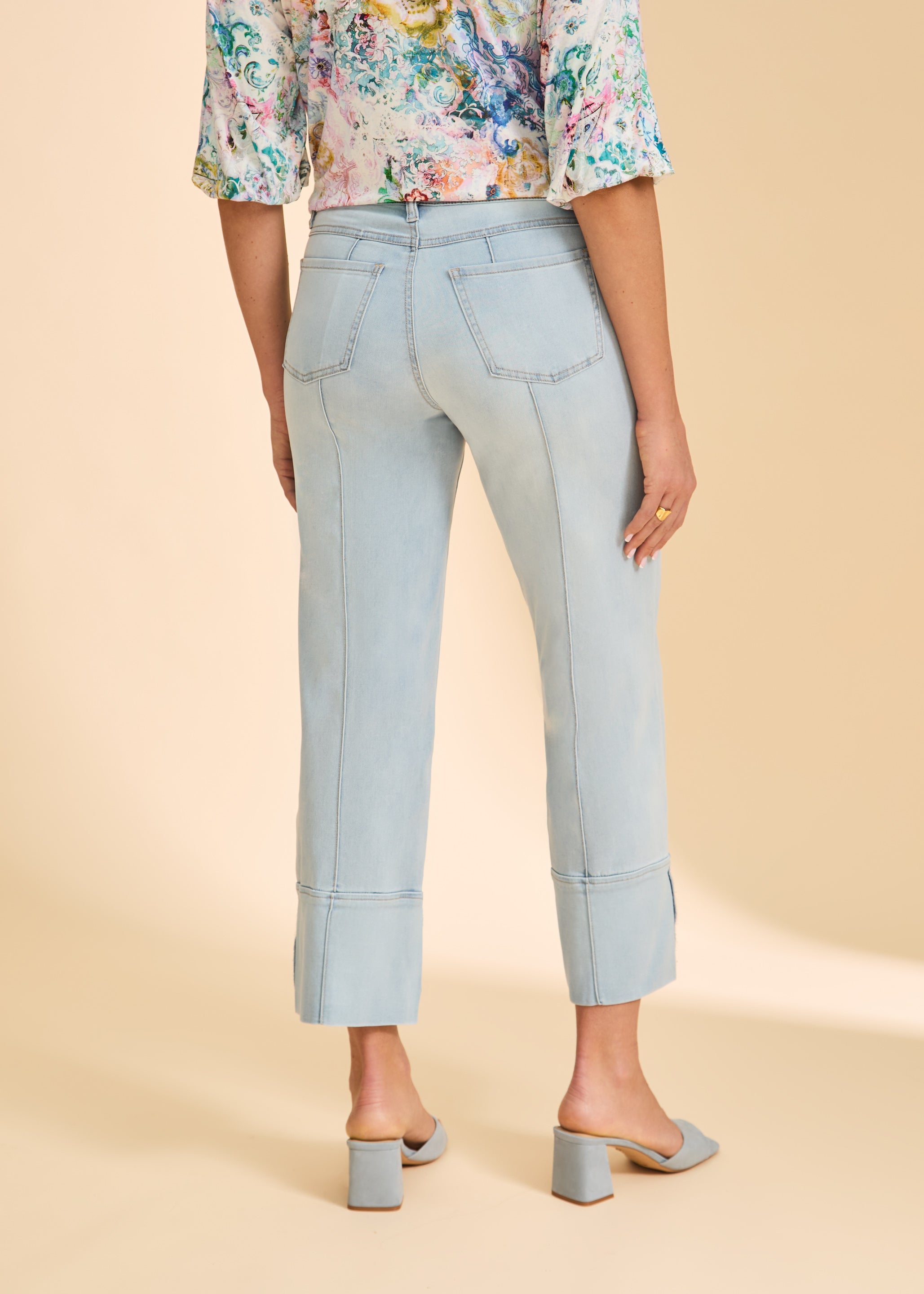 Back view of light wash wide-leg denim pants with seam lines and pockets by French Dressing Jeans (FDJ)