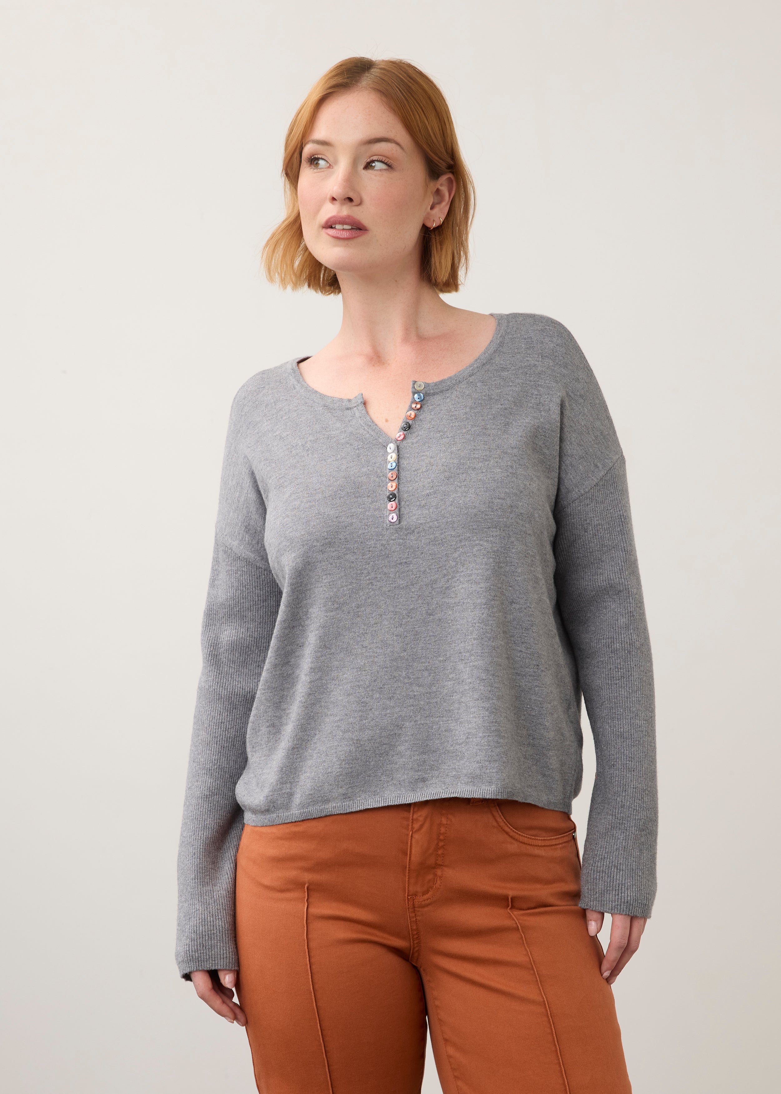 Front view of grey sweater featuring colorful buttons by French Dressing Jeans (FDJ)