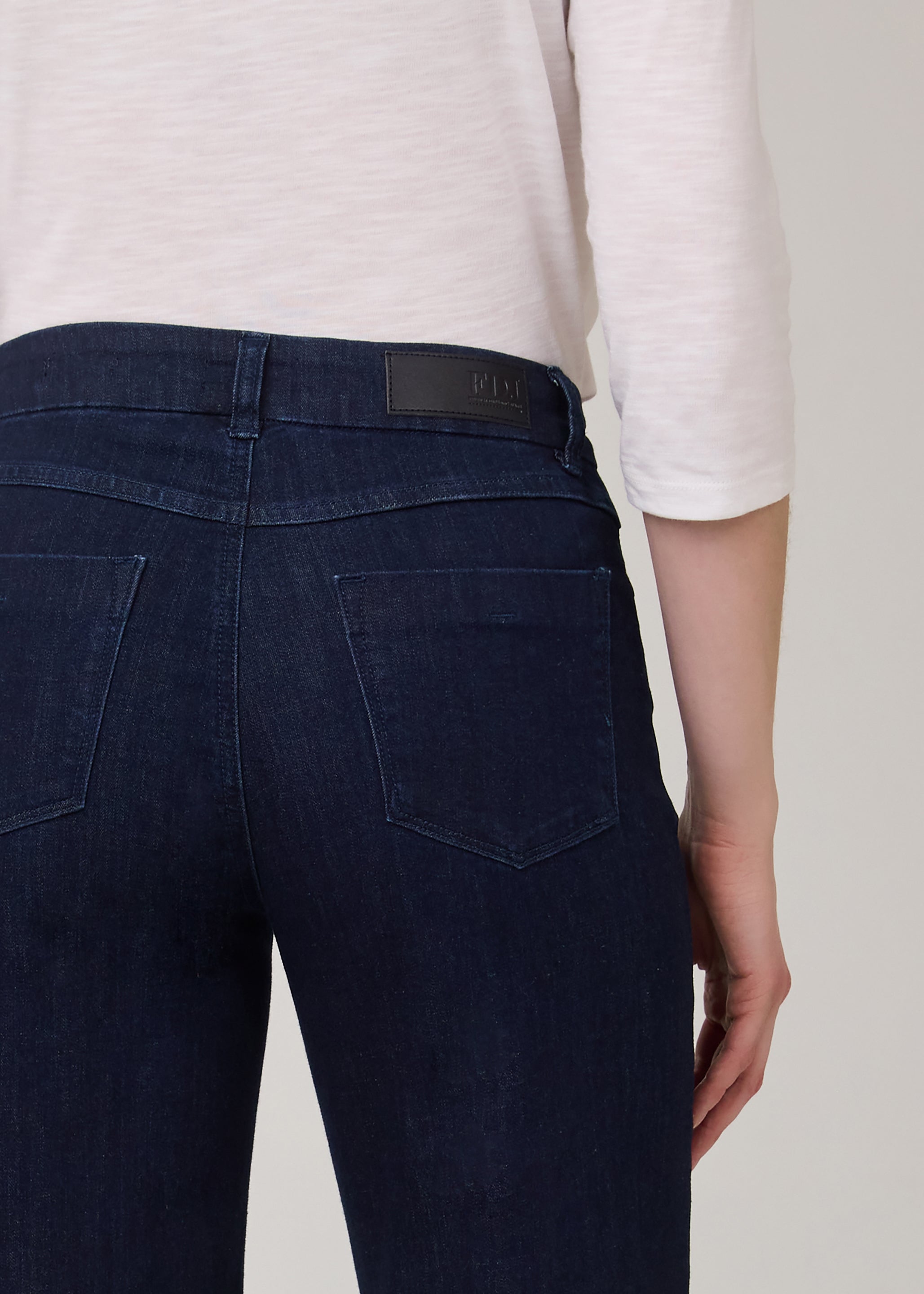 Detail shot of back pockets on dark Delight wide-leg jeans by French Dressing Jeans (FDJ)