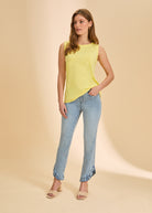 Full outfit with yellow sleeveless top and jeans featuring casual elegance by French Dressing Jeans (FDJ)