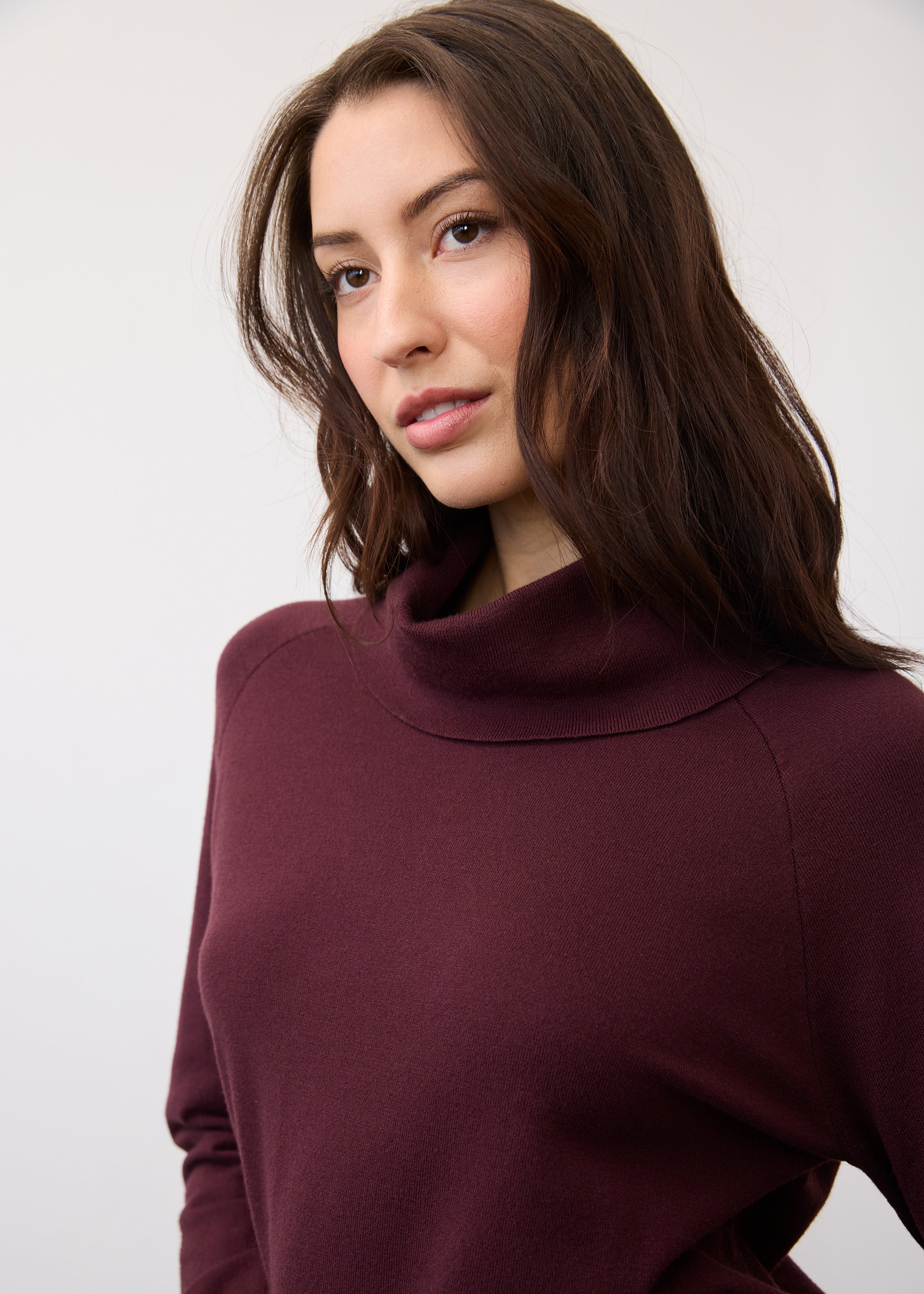 Close-up of cowl neck detail on burgundy sweater by French Dressing Jeans (FDJ)