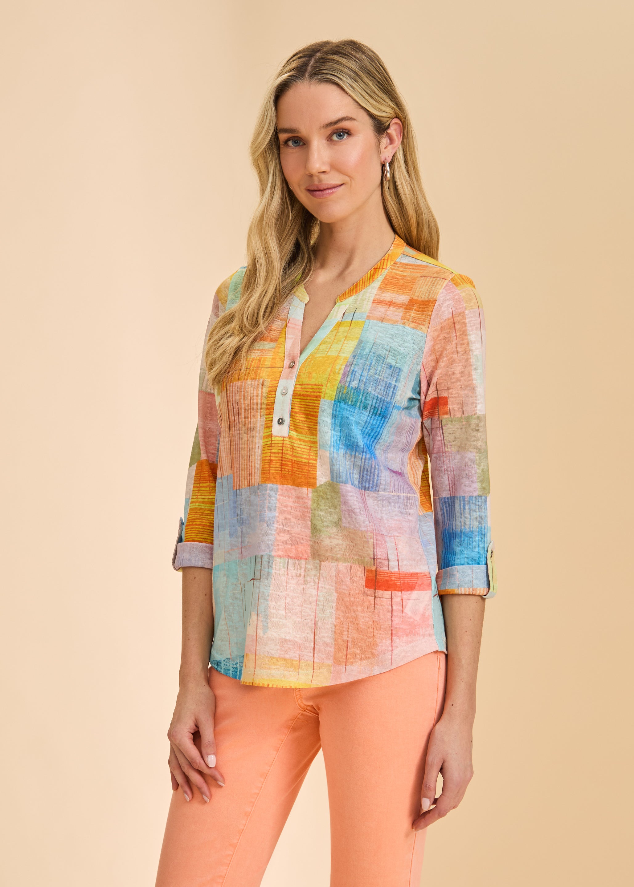 Front view of pastel patchwork 3/4 sleeve top with orange jeans by French Dressing Jeans (FDJ)