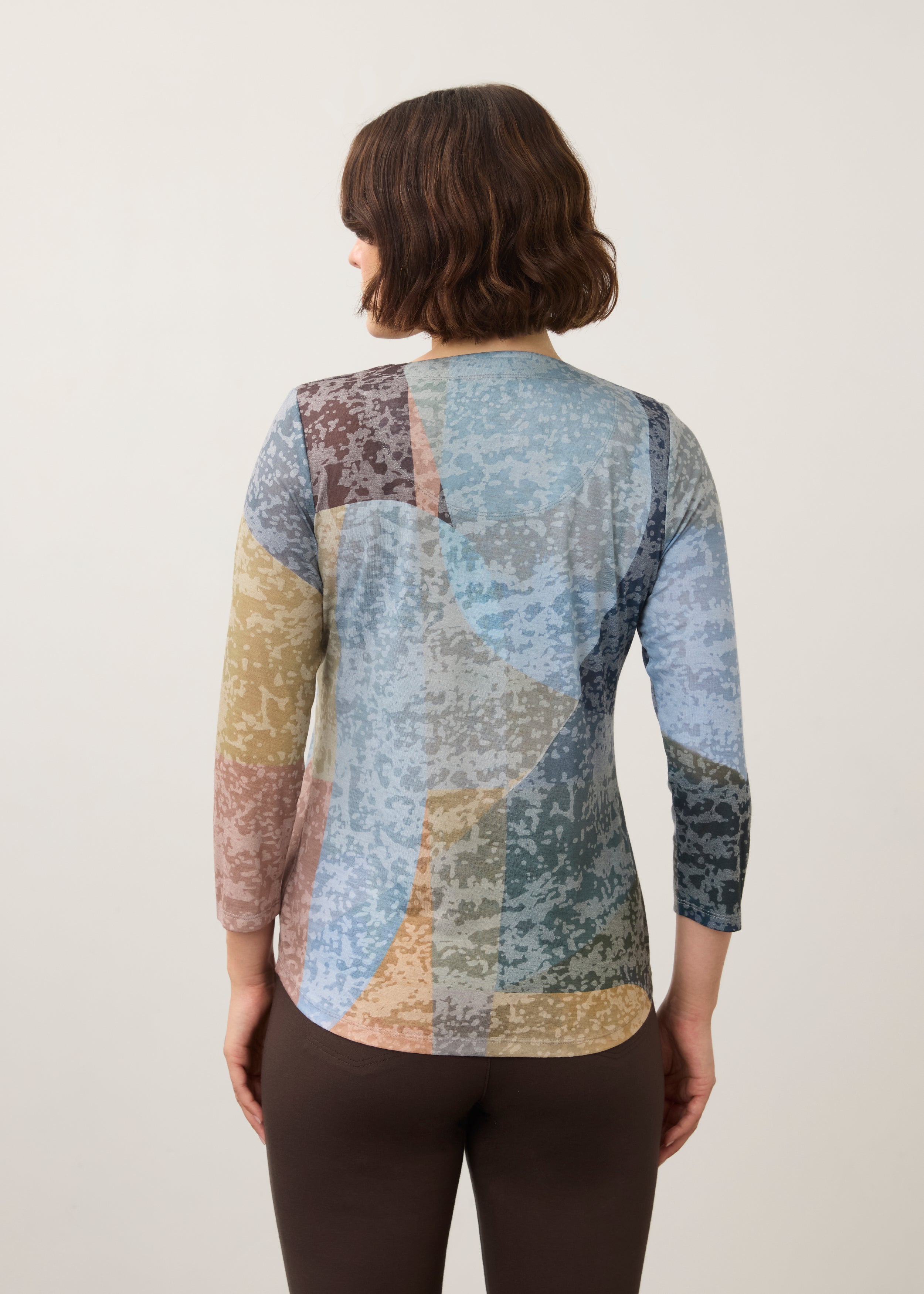 Back view of 3/4 sleeve top showing abstract pattern and rounded hem in Warn color by French Dressing Jeans (FDJ)