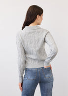 Back view of gray cabled cardigan showing textured knit pattern and ribbed hem by French Dressing Jeans (FDJ)