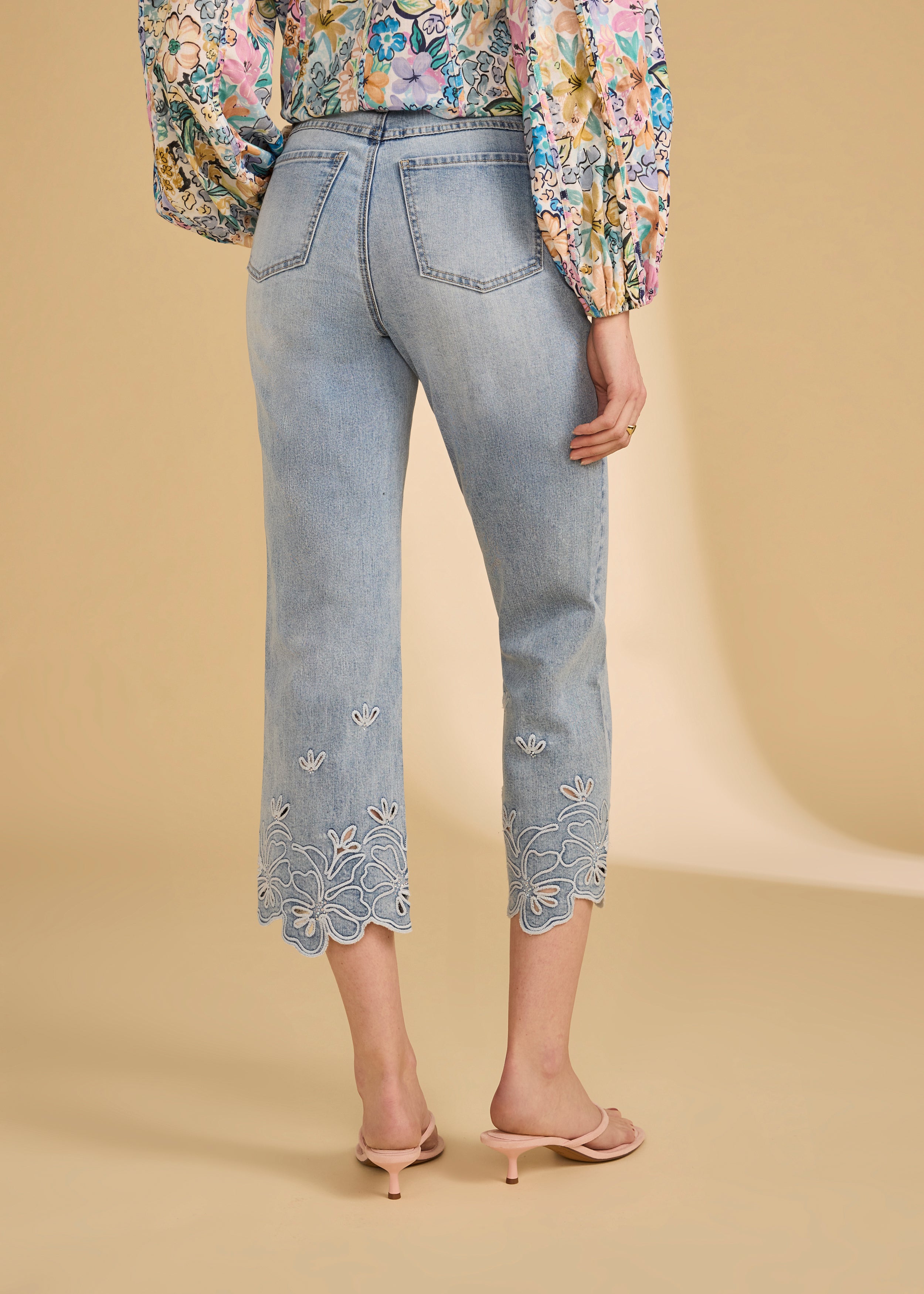 Back view of ocean denim jeans featuring floral embroidered hems by French Dressing Jeans (FDJ)