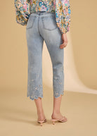 Back view of ocean denim jeans featuring floral embroidered hems by French Dressing Jeans (FDJ)