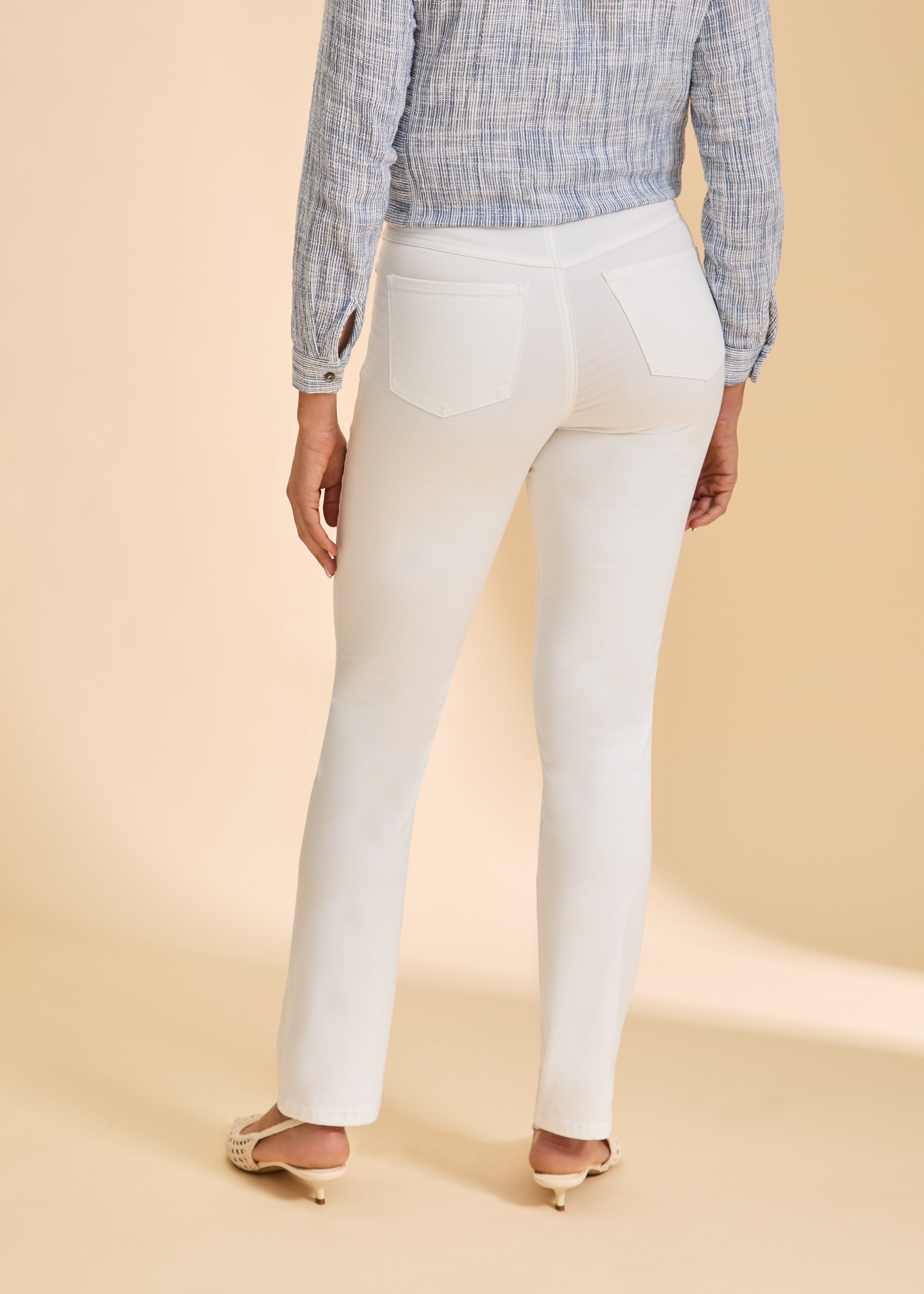 Back view of white straight-leg jeans, featuring classic pocket design by French Dressing Jeans (FDJ)