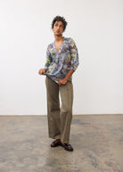Full body view of 3/4 sleeve V-neck top paired with khaki pants, showcasing floral print by French Dressing Jeans (FDJ)