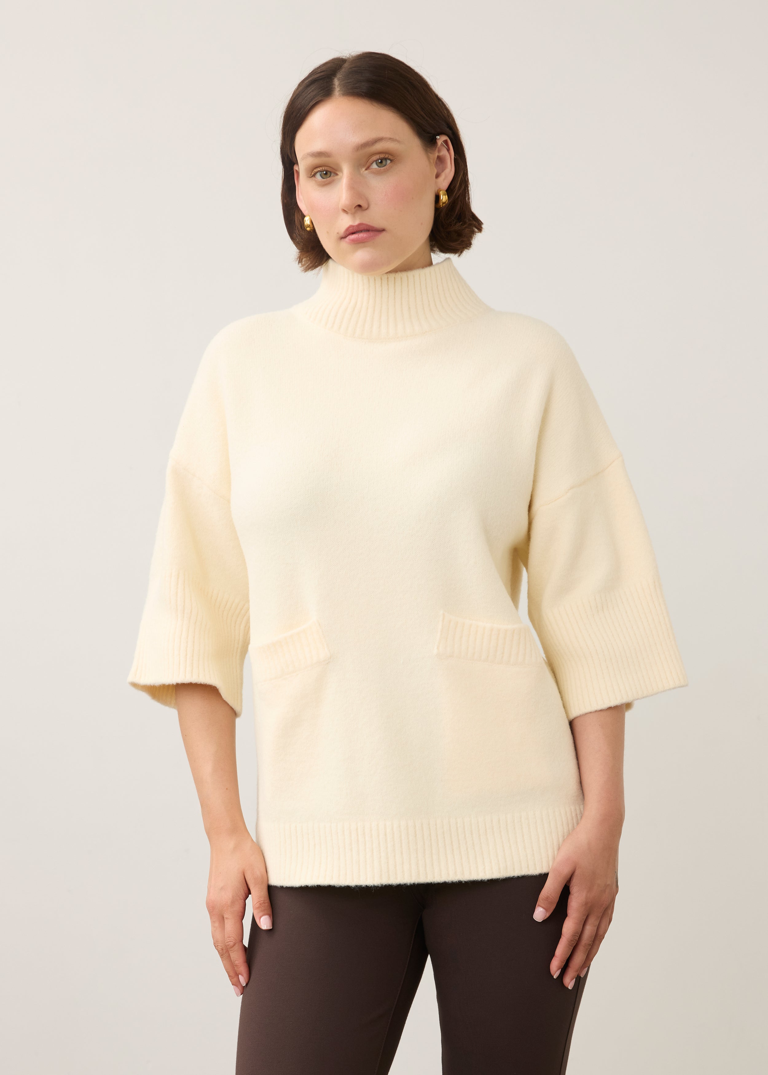 Front view of cream tunic sweater featuring ribbed pockets and sleeves by French Dressing Jeans (FDJ)