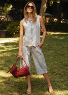 Outdoor shot of sleeveless top with powder wash denim shorts showing casual style by French Dressing Jeans (FDJ)