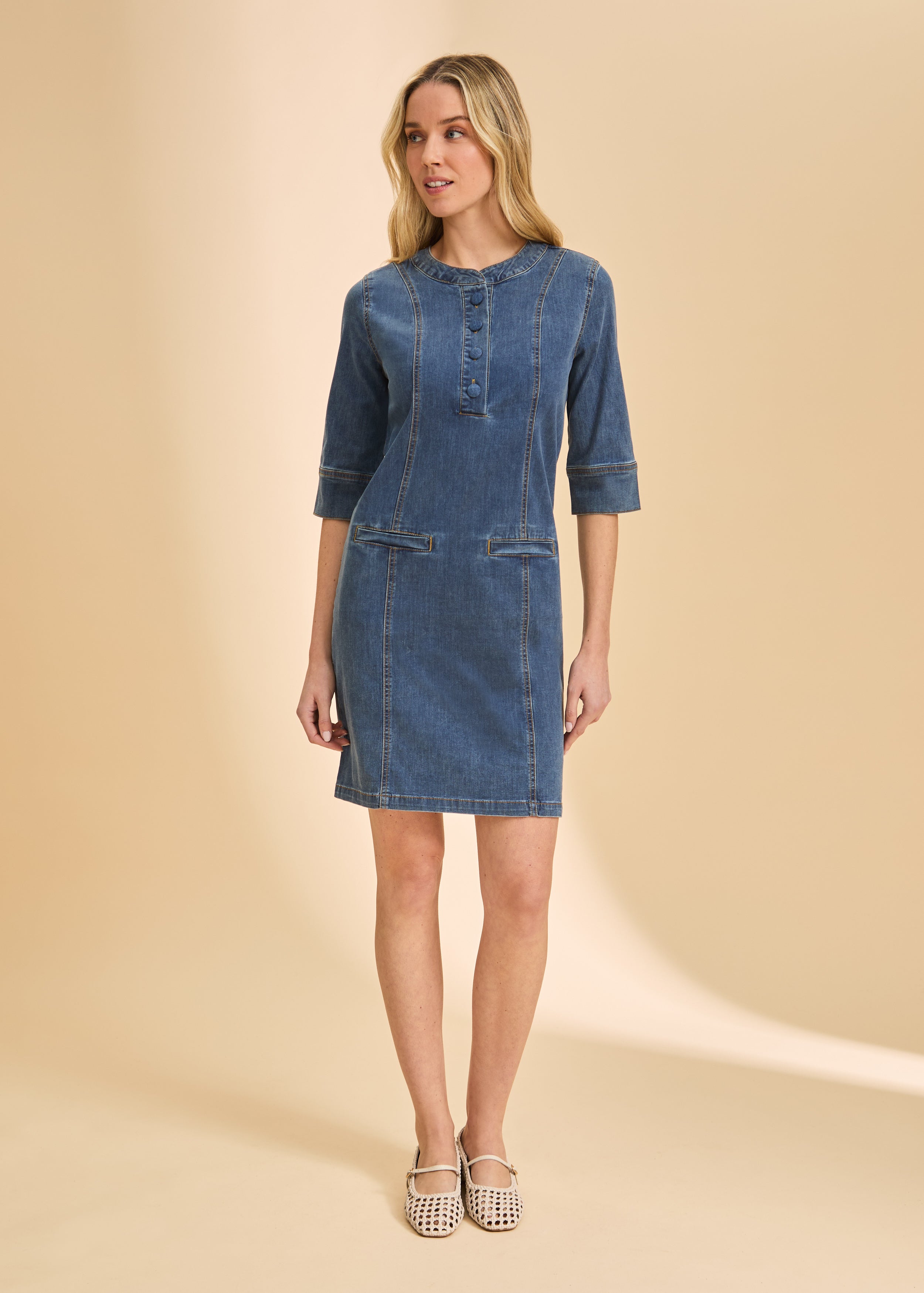 Full front view of denim dress highlighting seam details and round neckline by French Dressing Jeans (FDJ)