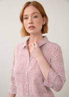 Close-up of striped red and white shirt focusing on button details by French Dressing Jeans (FDJ)