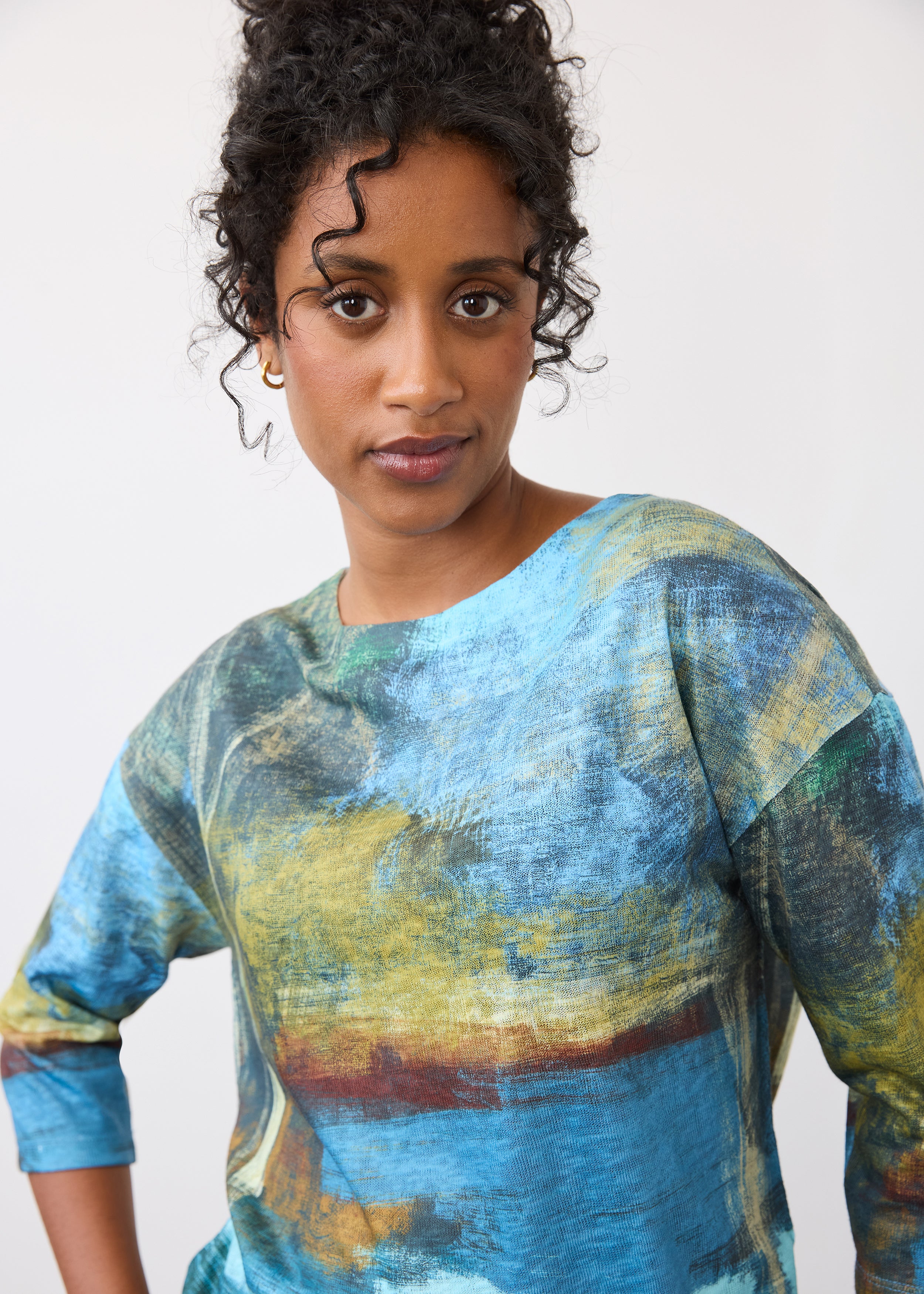 Close-up of blue abstract print top featuring round neckline and 3/4 sleeves by French Dressing Jeans (FDJ)