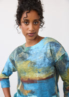 Close-up of blue abstract print top featuring round neckline and 3/4 sleeves by French Dressing Jeans (FDJ)