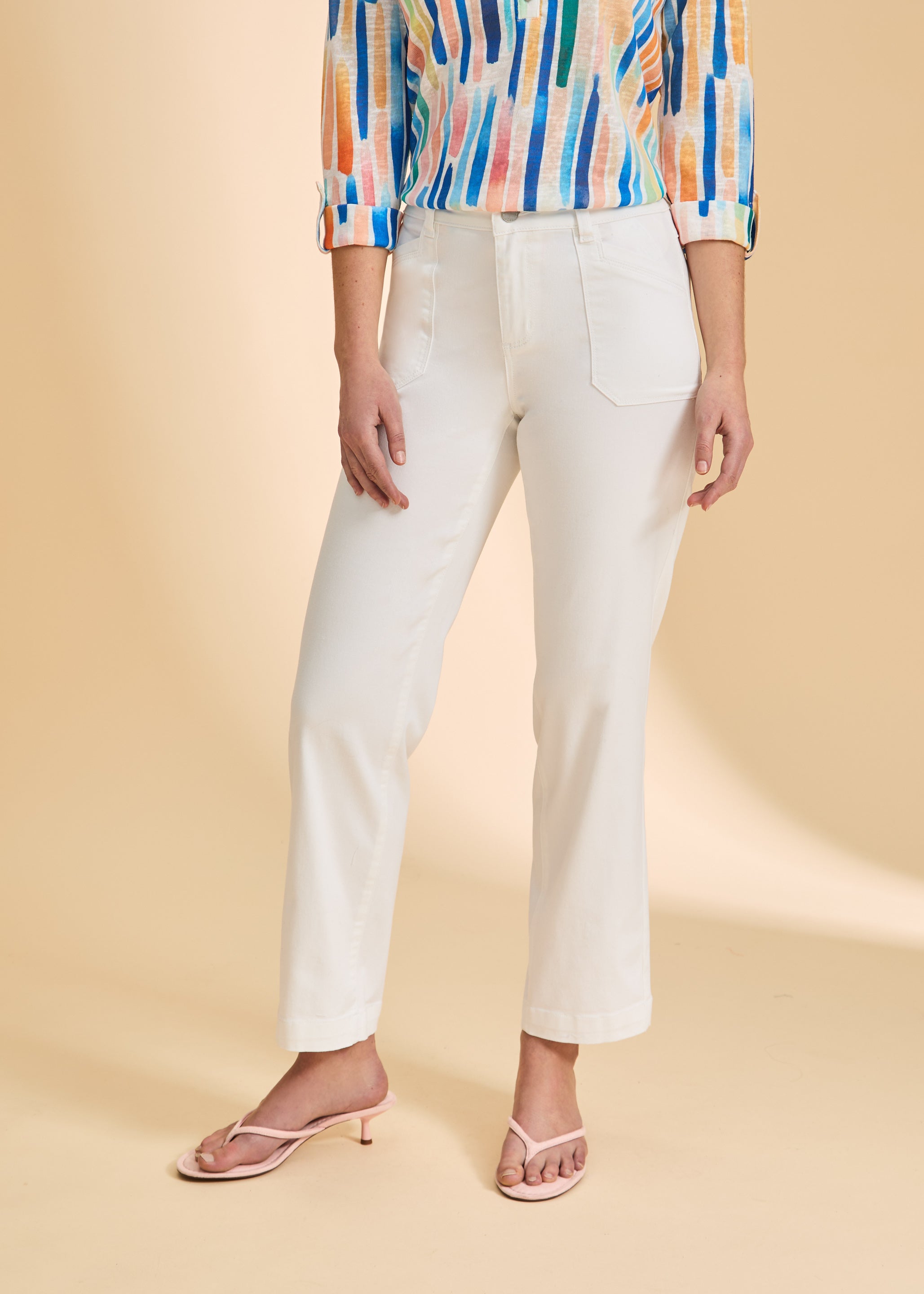 Close-up of white wide-leg pants with front pockets by French Dressing Jeans (FDJ)