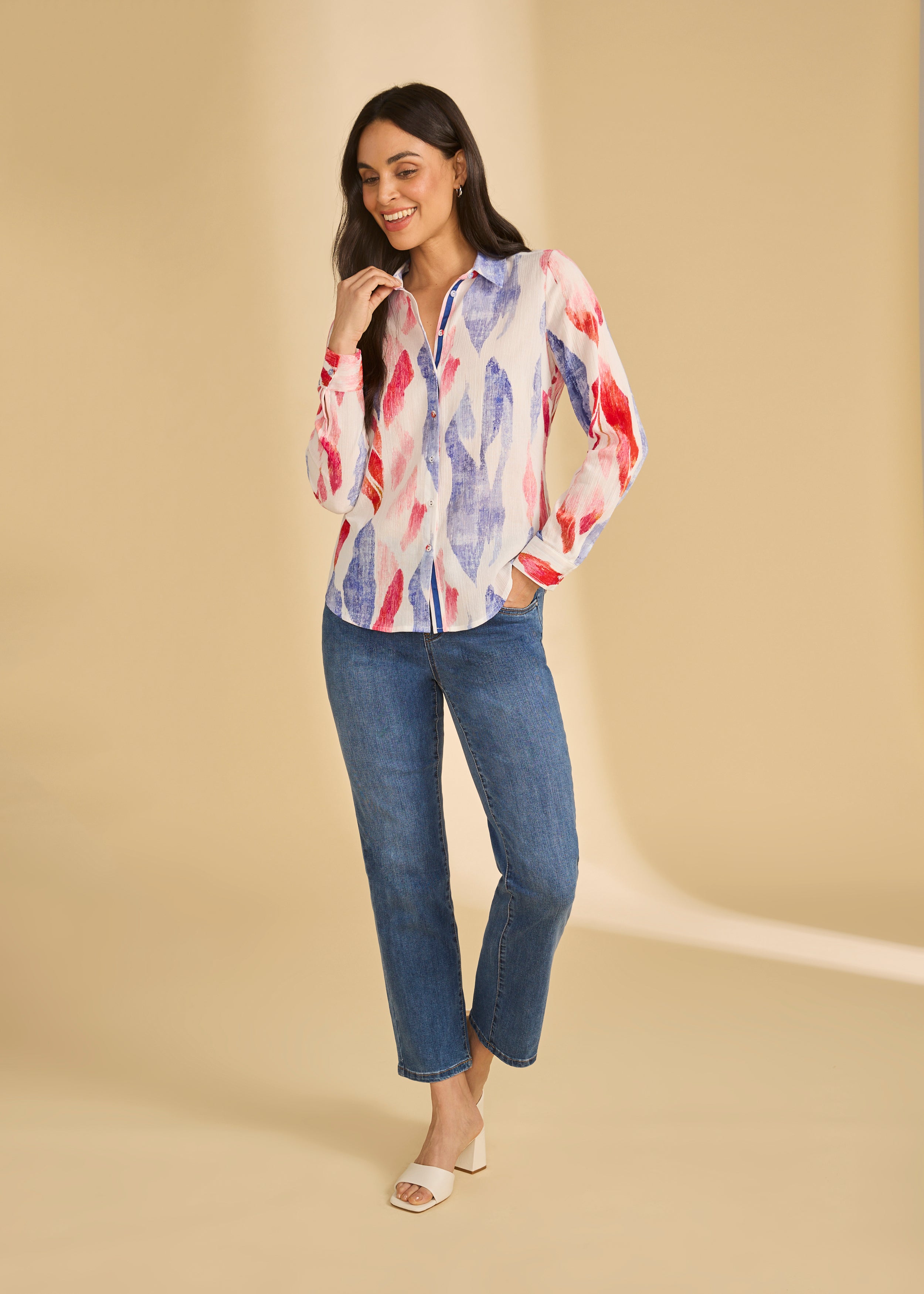 Full view of colorful long sleeve blouse paired with jeans, highlighting vibrant pattern, by French Dressing Jeans (FDJ)