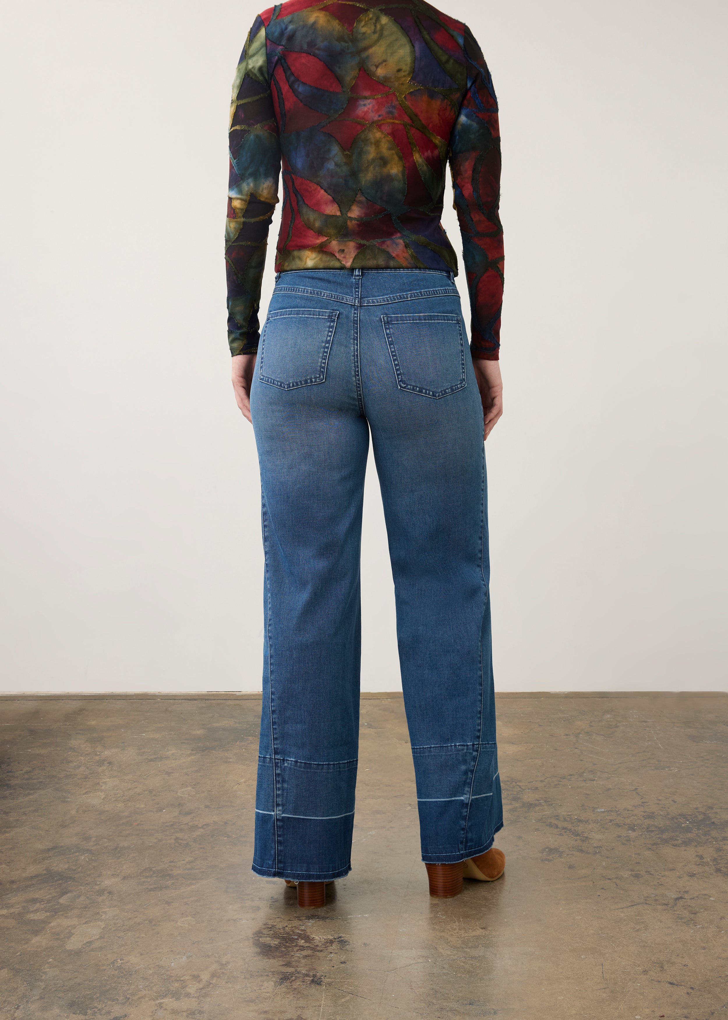 Back view of wide-leg dark wash jeans with artistic top, featuring patch pockets by French Dressing Jeans (FDJ) par French Dressing Jeans (FDJ)