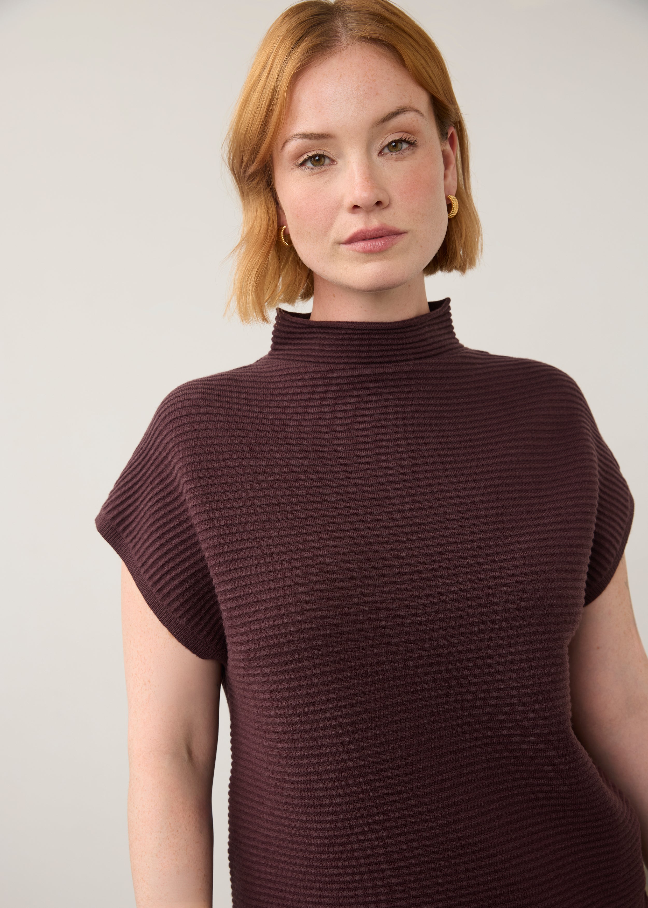 Close-up of burgundy ribbed top highlighting high collar and short sleeves by French Dressing Jeans (FDJ)