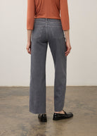 Back view of denim with raw hem and patch pockets in blue by French Dressing Jeans (FDJ) par French Dressing Jeans (FDJ)