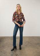 Model wearing vibrant floral shirt with jeans, full body view by French Dressing Jeans (FDJ)