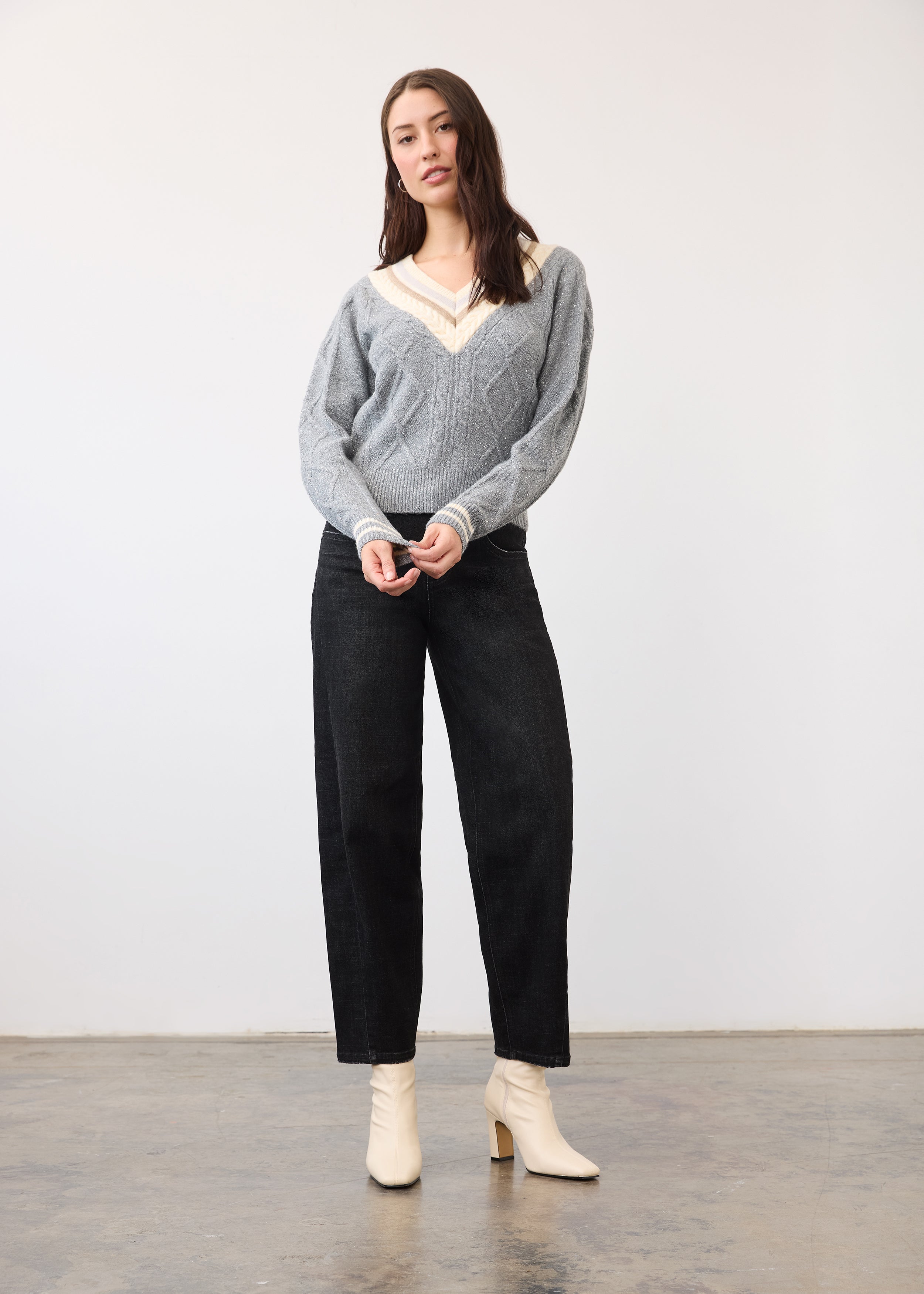 Full view of model in metallic gray V-neck sweater with relaxed fit by French Dressing Jeans (FDJ)