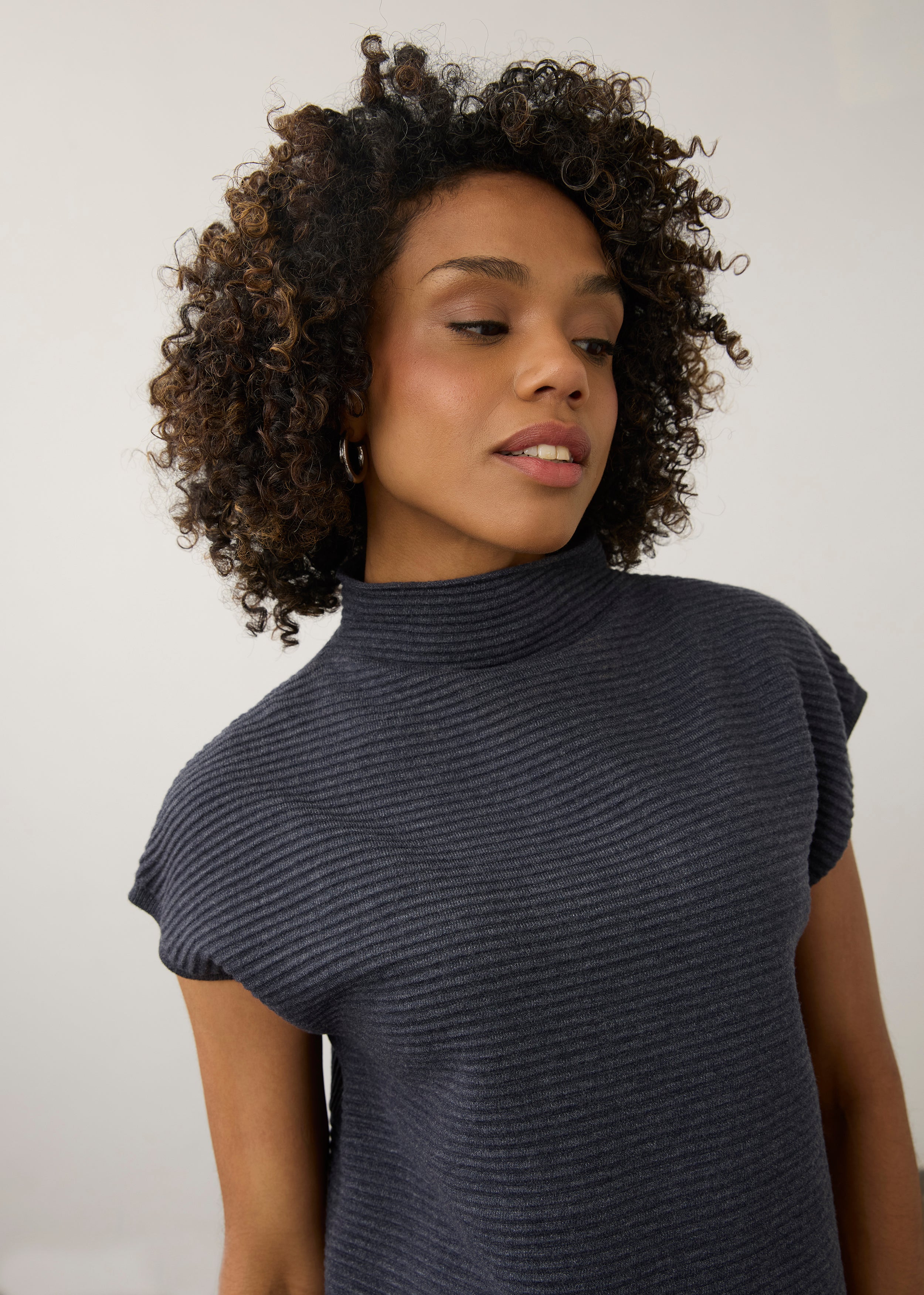 Close-up of navy ribbed top highlighting high collar and short sleeves by French Dressing Jeans (FDJ)