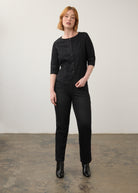 Full outfit view of black straight-leg jeans paired with matching button-up top by French Dressing Jeans (FDJ)