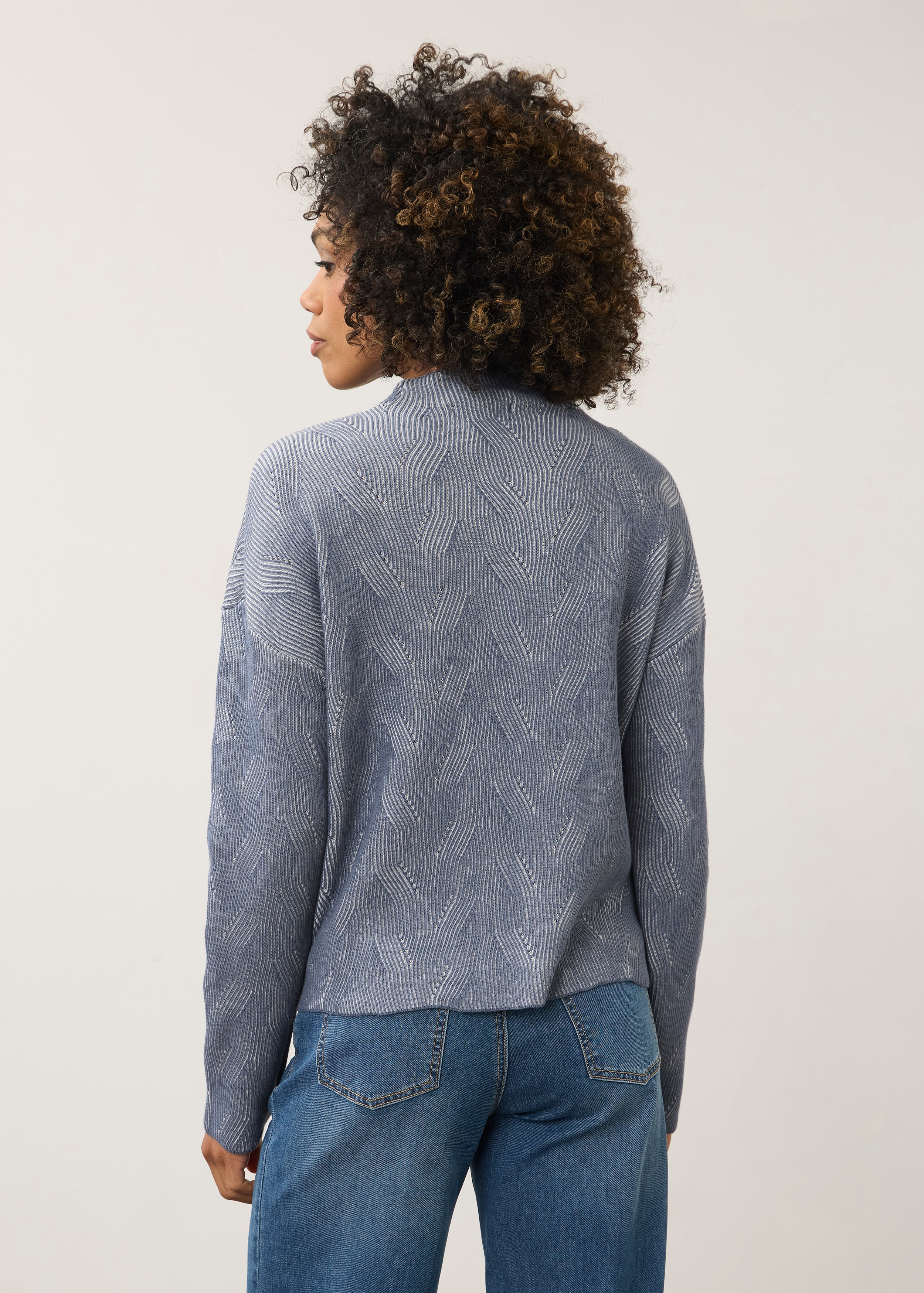Back view of blue textured top showing seamless design by French Dressing Jeans (FDJ)