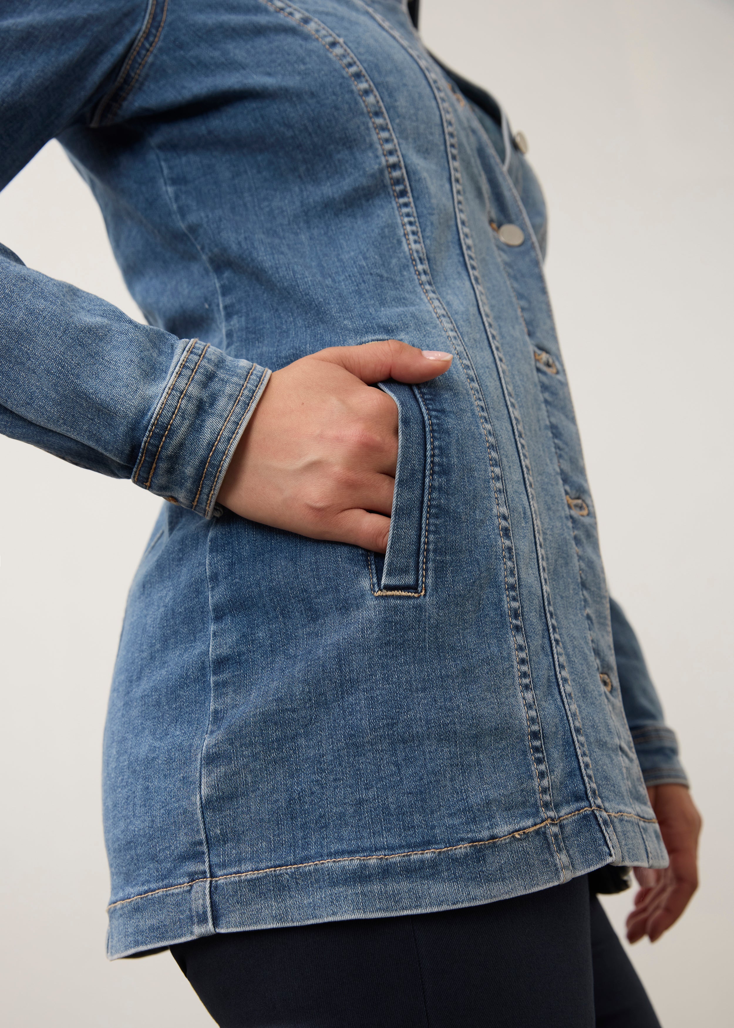 Side view of medium wash denim jacket showing side seam pocket detail by French Dressing Jeans (FDJ) par French Dressing Jeans (FDJ)