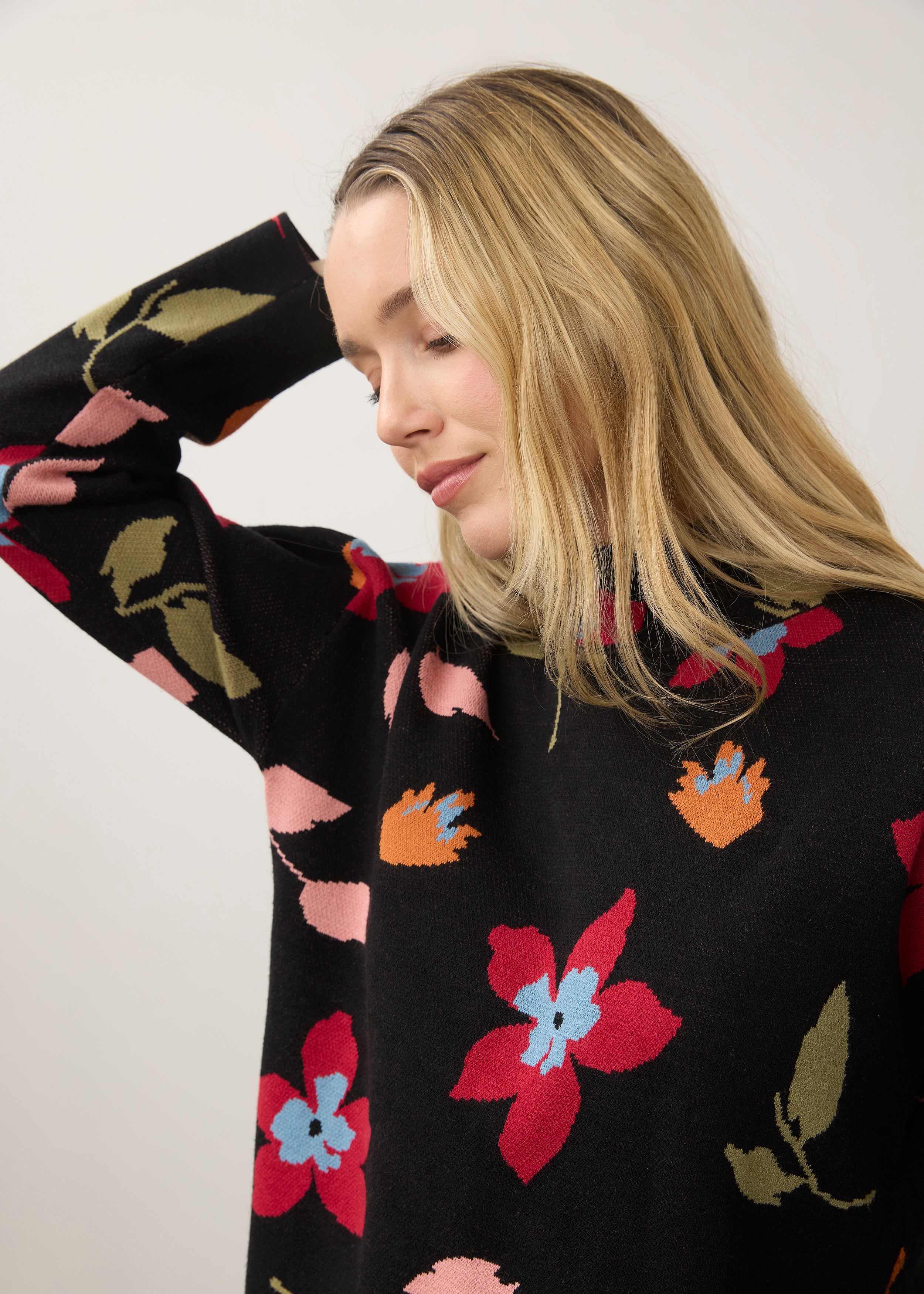 Close-up of black floral sweater with high collar detail by French Dressing Jeans (FDJ)