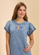 Close-up of chambray shift dress highlighting keyhole neckline and sleeve details in snow wash by French Dressing Jeans (FDJ)