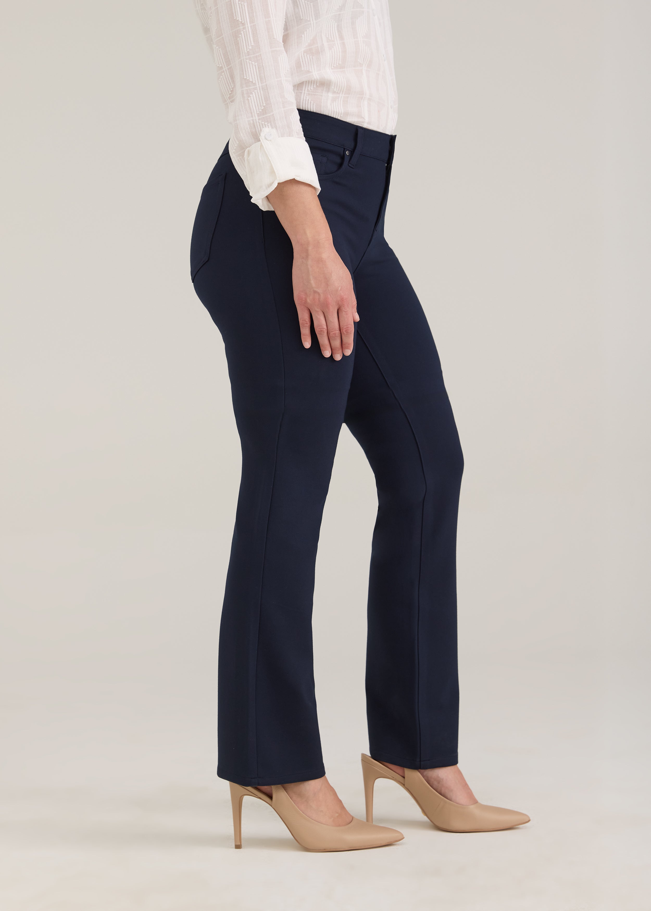 Side profile of navy pants highlighting leg silhouette and front pockets by French Dressing Jeans (FDJ)