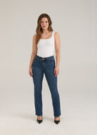 Full body view of woman in dark wash slim leg jeans with sleek fit by French Dressing Jeans (FDJ)