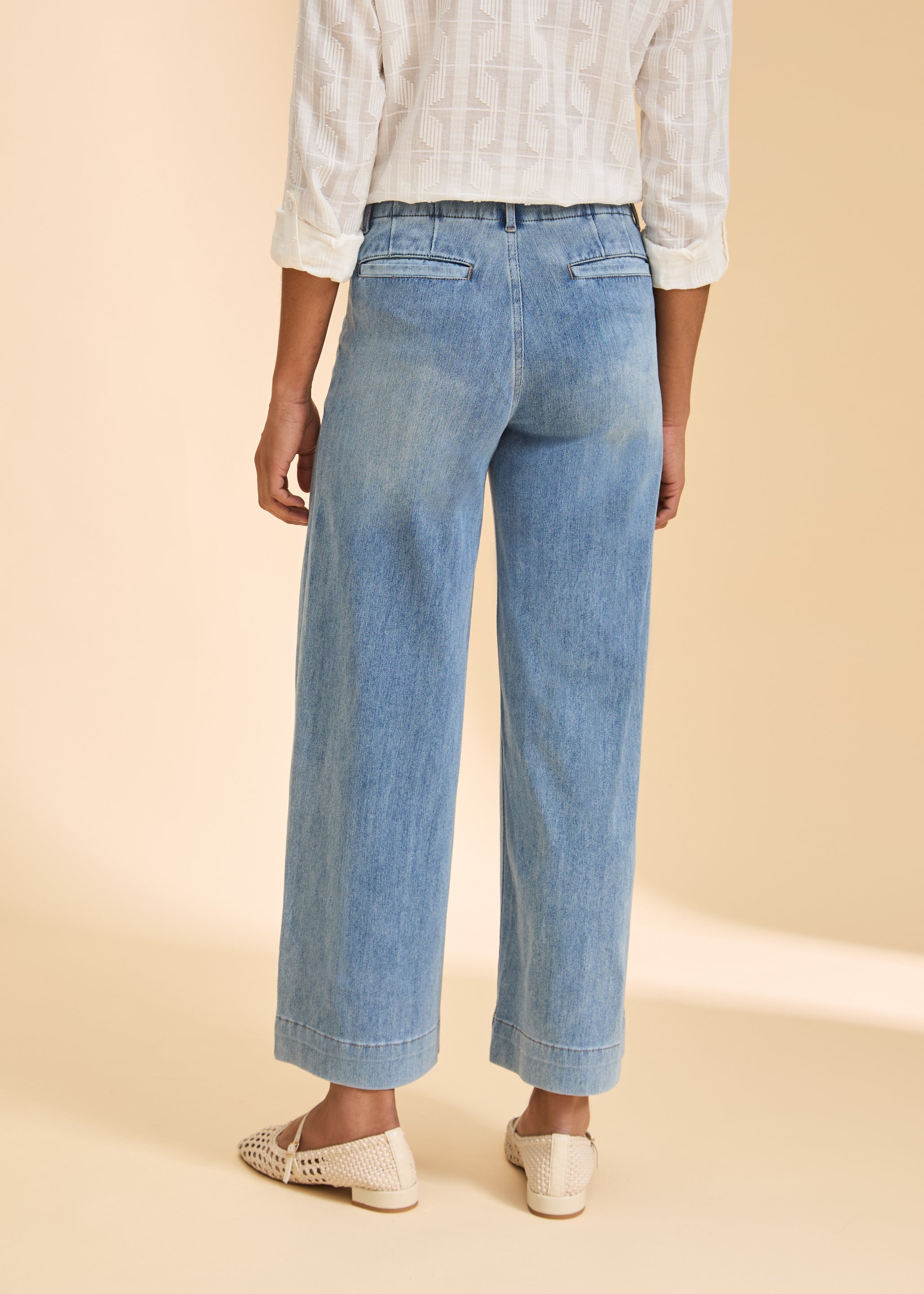 Back view of light blue wide-leg jeans with welt pockets by French Dressing Jeans (FDJ)