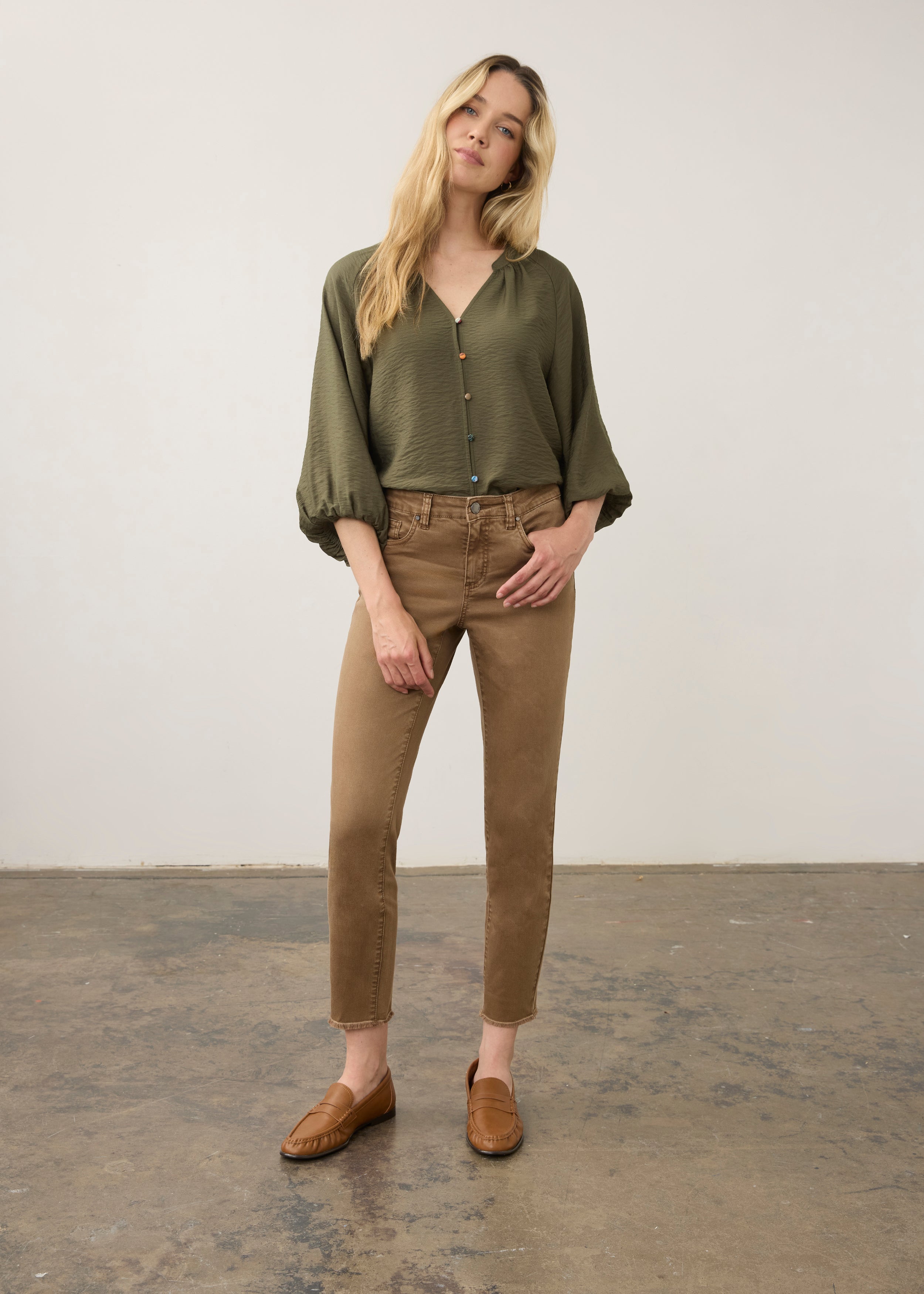 Model in olive blouse and khaki pants, full body view by French Dressing Jeans (FDJ)