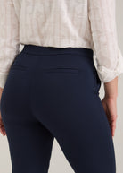 Detail shot of navy Ponte pants showing fake back welt pockets and fabric texture by French Dressing Jeans (FDJ)