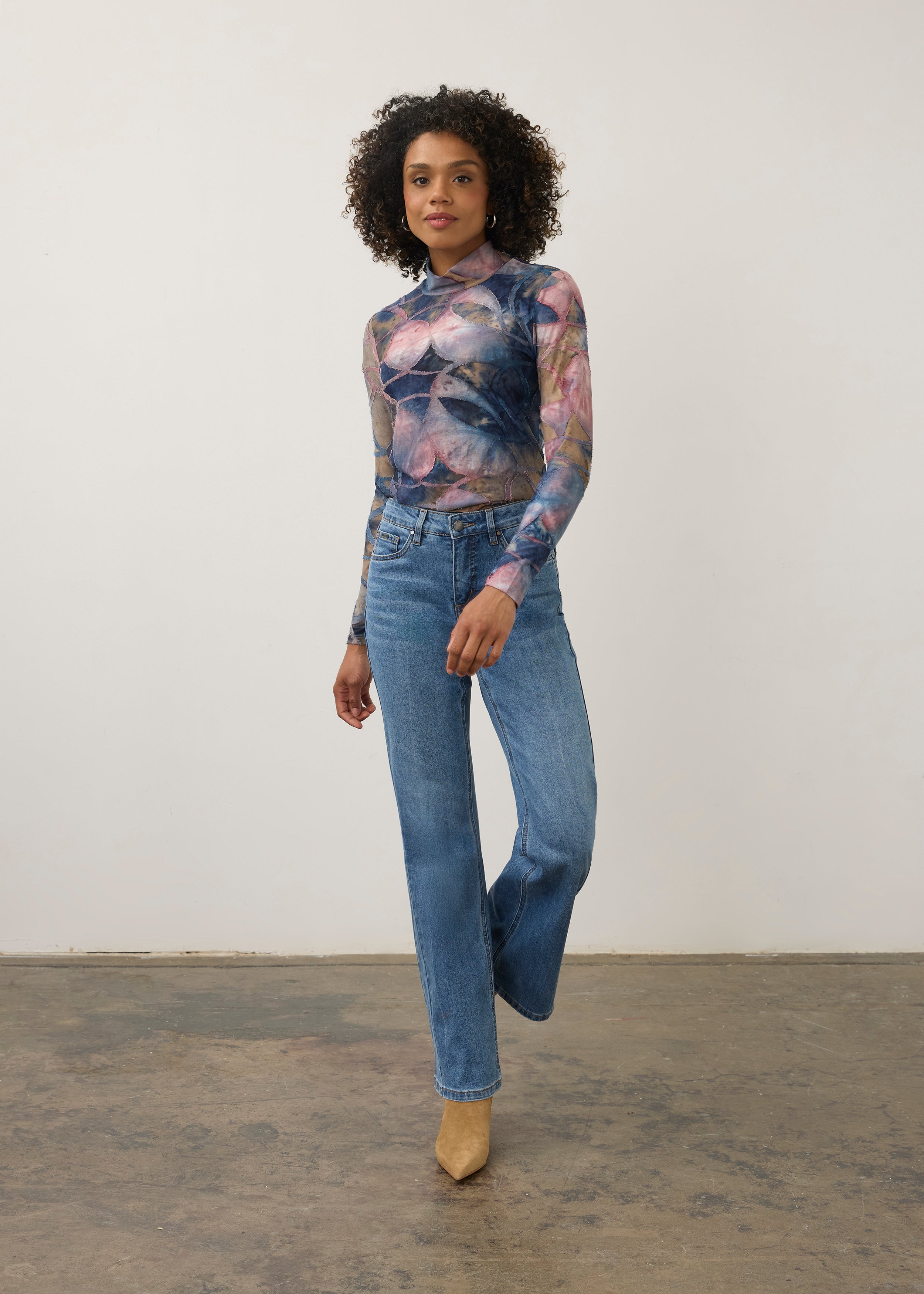 Full body view of abstract blue and pink print top with denim jeans, chic casual style by French Dressing Jeans (FDJ)