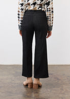 Back view of black denim featuring patch pockets and wide-leg cut by French Dressing Jeans (FDJ)