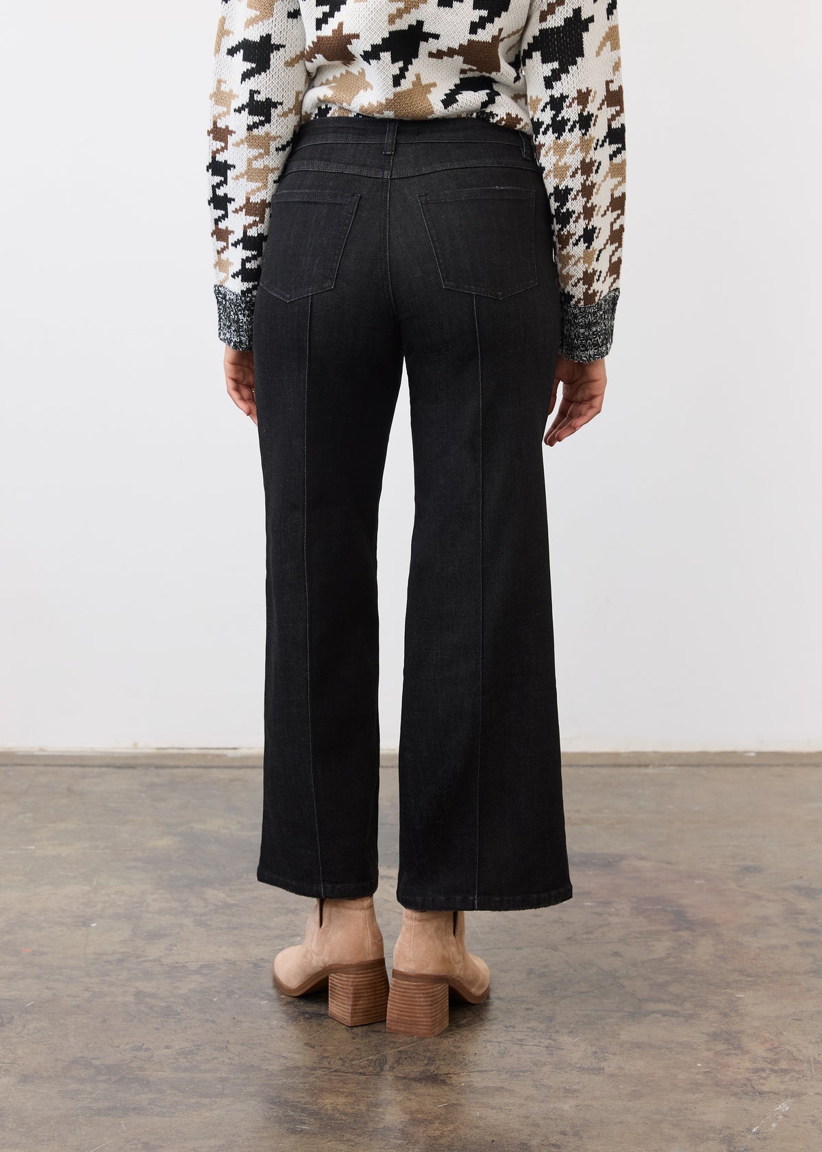 Back view of black denim featuring patch pockets and wide-leg cut by French Dressing Jeans (FDJ)